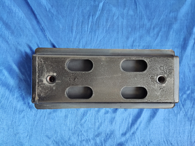 Two holes of track shoe rubber block