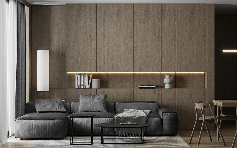 沙发背景是客厅的重要部分，人们起居焦点，极简的木饰面搭配柜类，反映出主人的生活品质。